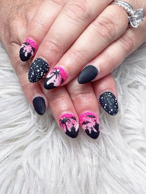 Medium almond nails with matte black and vivid pink night scenes featuring spiders, bats, stars, and haunted silhouettes.