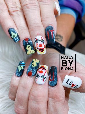 Medium square nails with horror-clown faces, red balloons, paper boats, dark backgrounds, and painted text details.