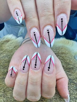 Long almond nails with sheer pink bases, white chevron French tips, hot pink outlines, and centered black lines and dots.